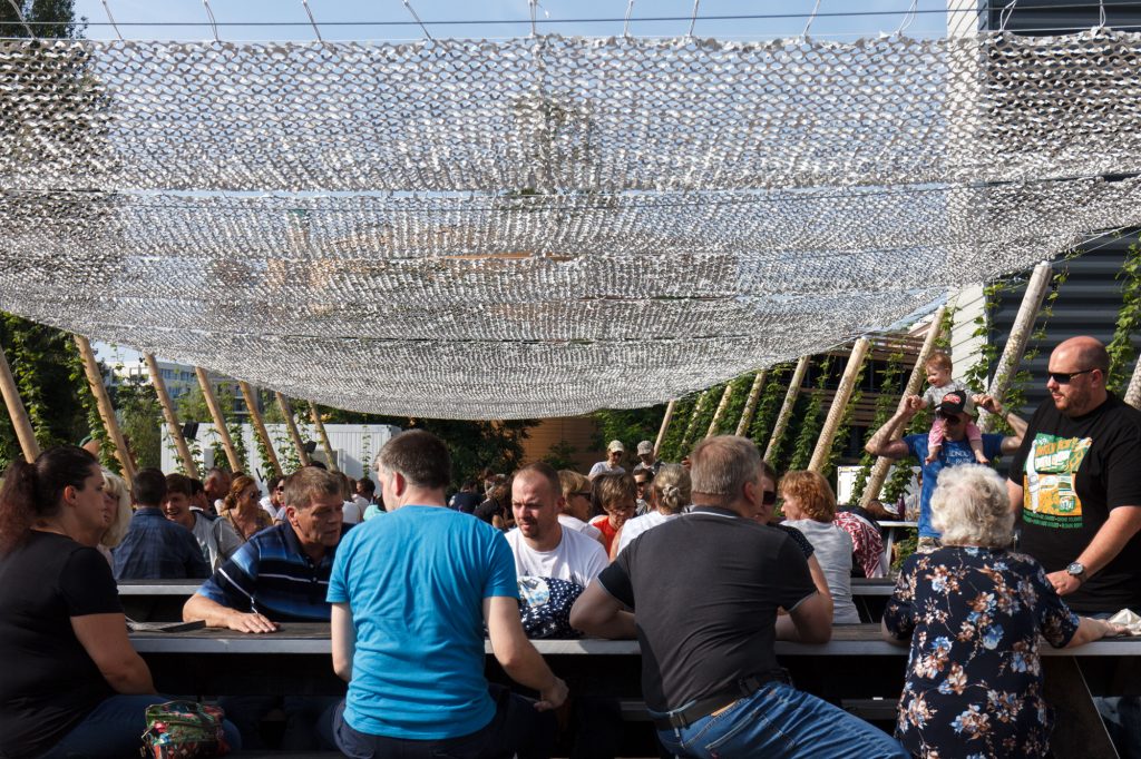 Enjoying the sunny weather in the beer garden at BRLO Brwhouse - a craft beer brewery, bar, restaurant and beer garden and the edge of Park am Gleisdreieck in Berlin