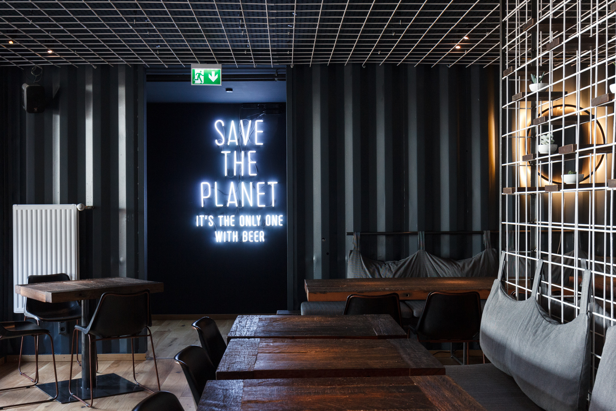 SAVE THE PLANET - IT’S THE ONLY ONE WITH BEER neon artwork at BRLO Brwhouse - a craft beer brewery, bar, restaurant and beer garden and the edge of Park am Gleisdreieck in Berlin