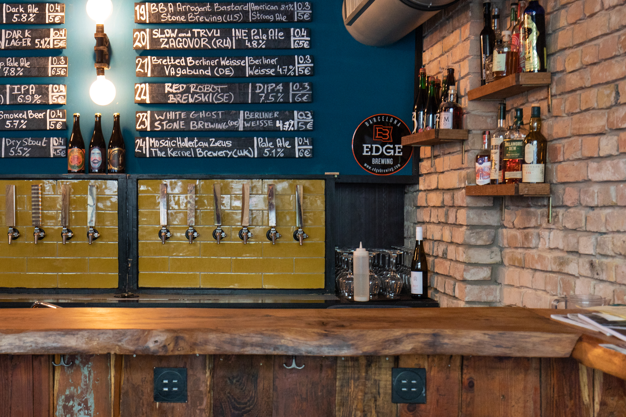 The corner of the bar at Protokoll Taproom Berlin, a craft beer bar with 24 taps in Berlin Friedrichshain