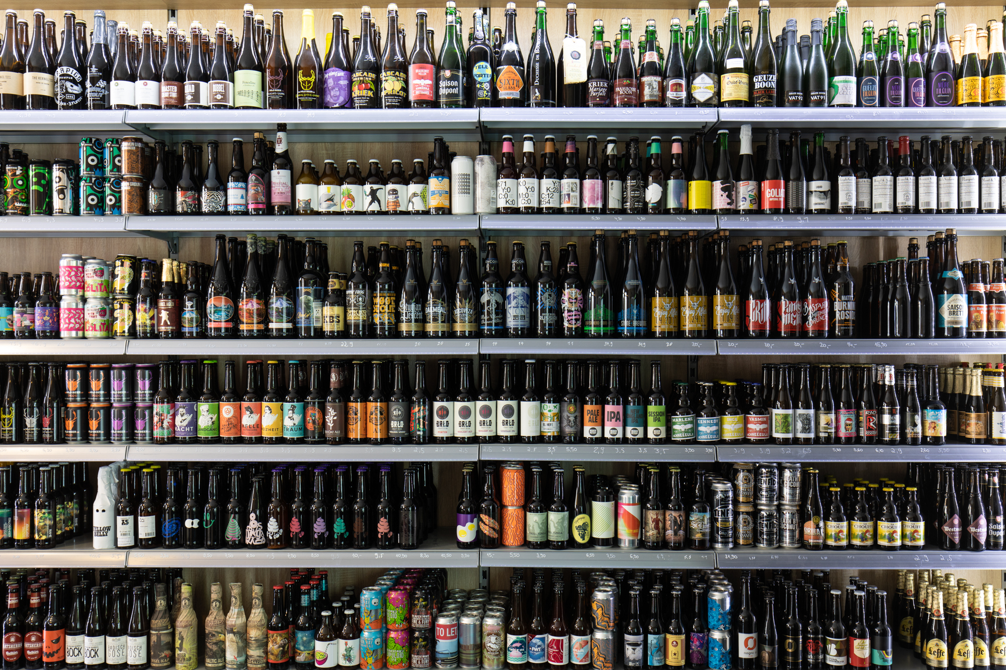 Shelves full of beer at Biererei Store Berlin - a craft beer bottle shop in Kreuzberg